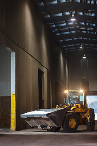 A bulldozer moving salt.
